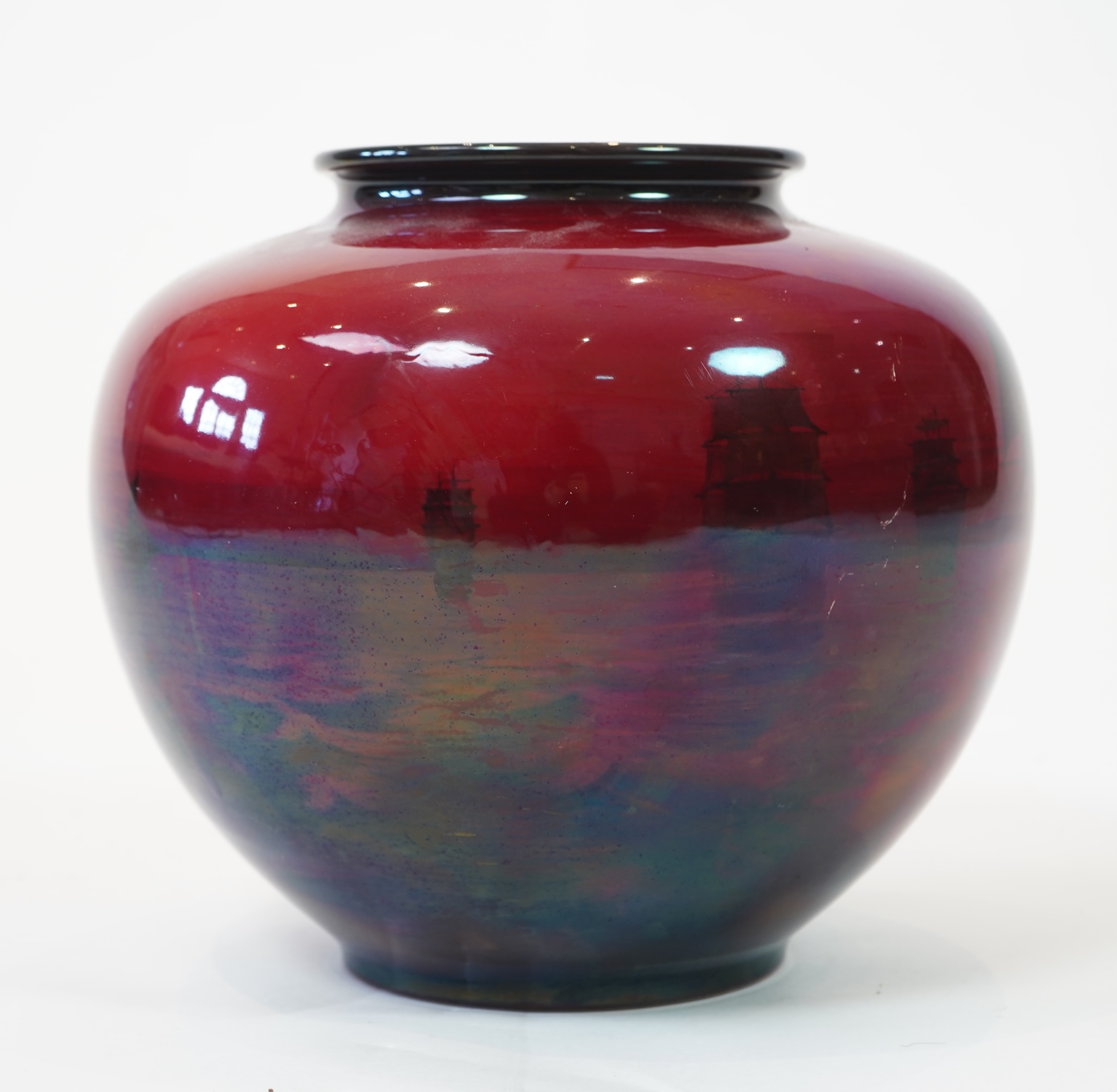 A large Doulton flambe vase decorated with ships, 29cm high